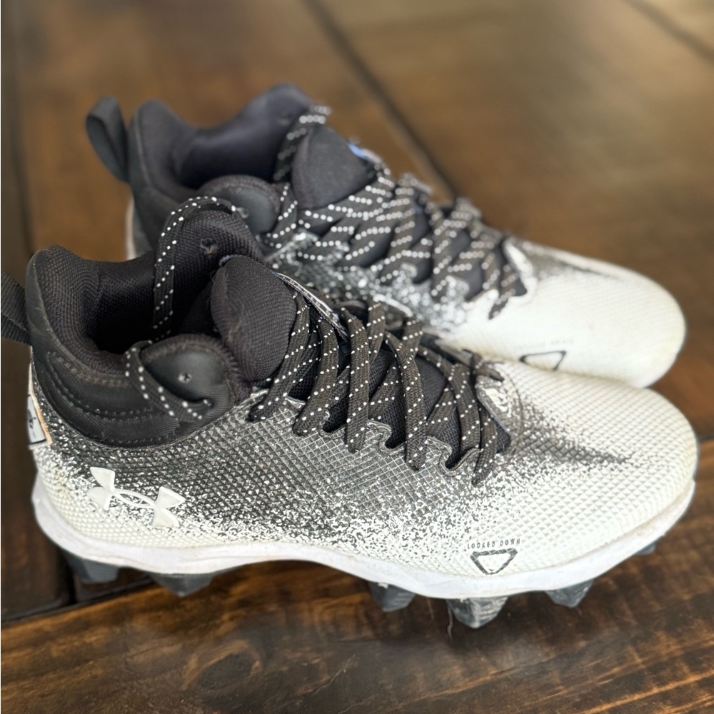 Under Armour Kids' Black and White football cleats